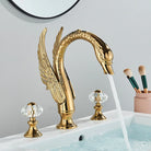 Gold Swan Widespread Faucet with Crystal Handles, on a vanity