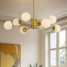 Eight-light gold chandelier with white glass globes in a bright room