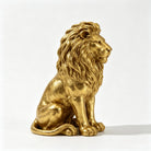 Gold seated lion statue, side profile