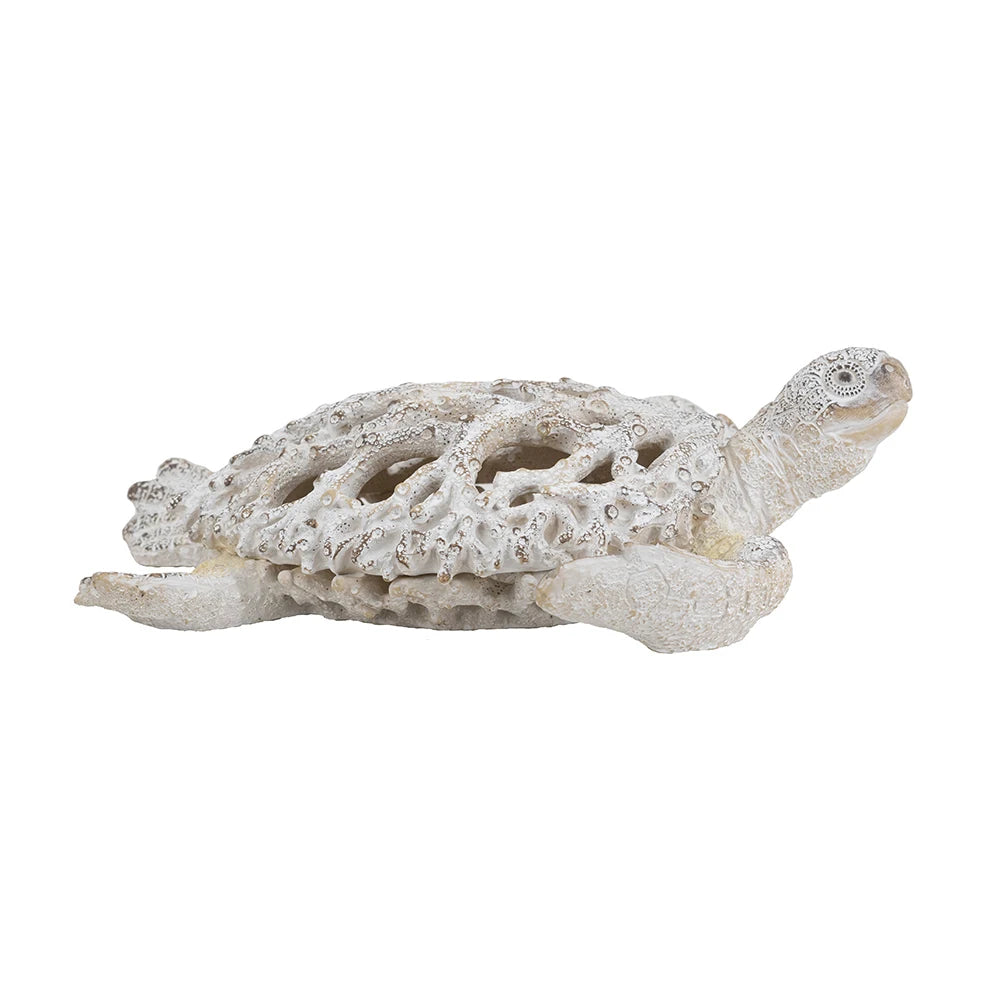 White coral-pattern sea turtle sculpture, side view