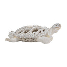 White coral-pattern sea turtle sculpture, side view