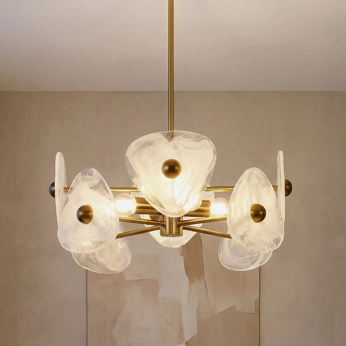 Close view of the gold chandelier with frosted petal shades