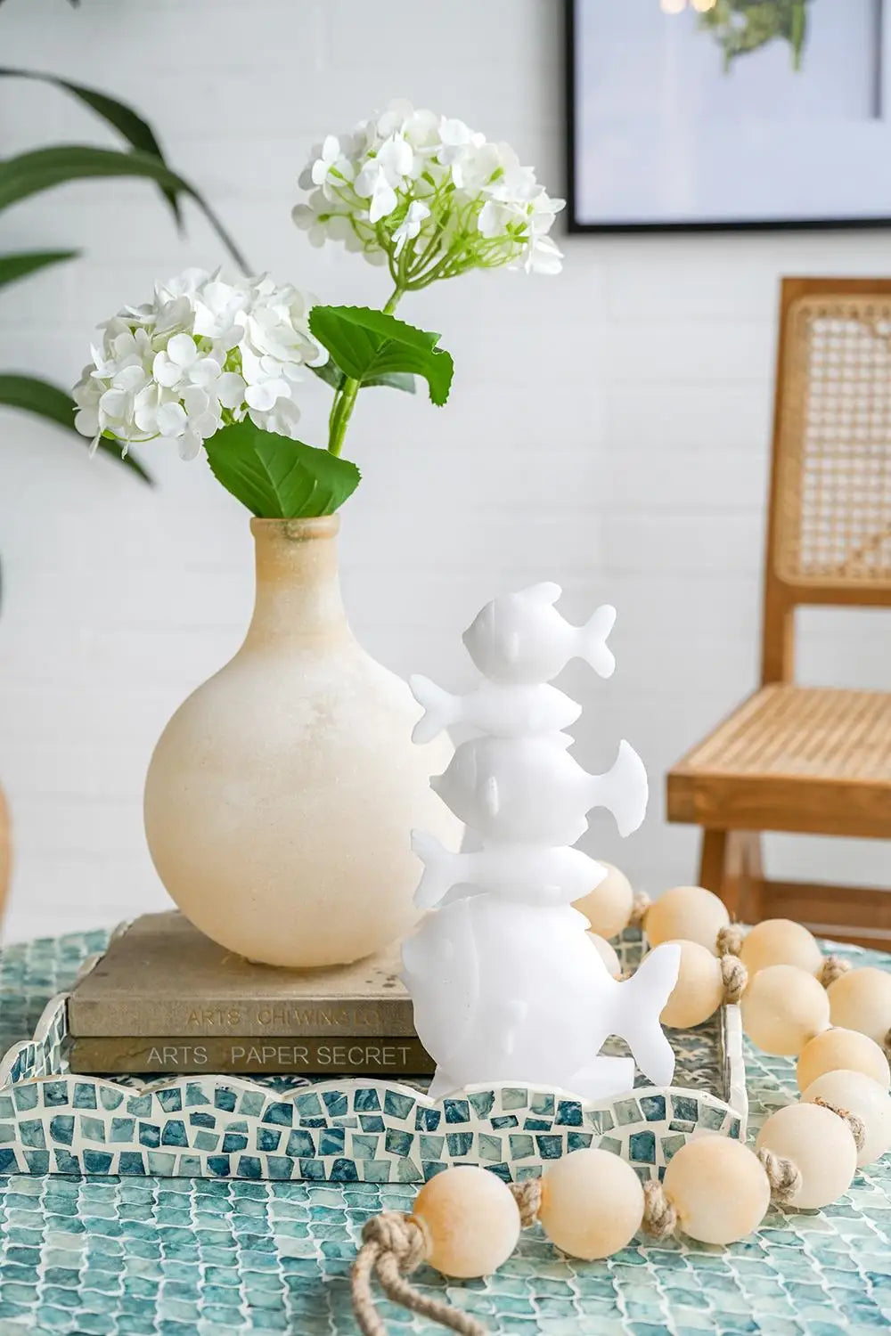 Frosted glass vase with white hydrangeas on a coffee table