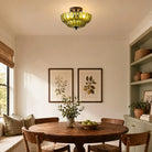 Green petal glass ceiling light in a dining room