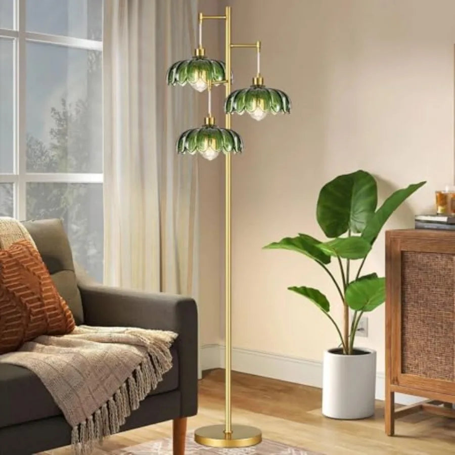 Gold Palm Floor Lamp with Green Glass Shades beside a sofa and potted plant