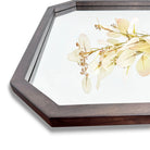 Close-up of the octagon walnut wood mirror frame corner showing its beveled edge