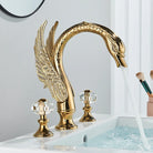 Gold Swan Widespread Faucet with Crystal Handles, on a white basin