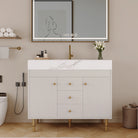 White 36 in bathroom vanity with gold legs and a marble-look top