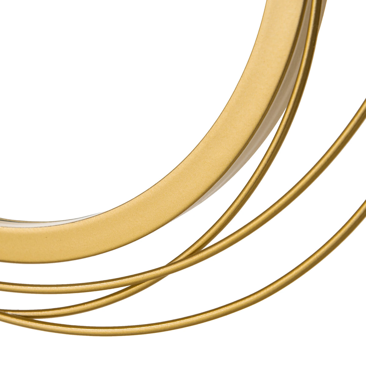 Close-up of the gold-finish metal ring frame on the round wall mirror