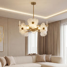 Gold chandelier with shell-look shades in a living room