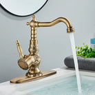 Side angle of the carved antique brass faucet with tall lever handle and curved spout