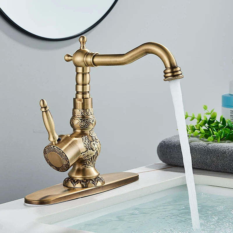 Side angle of the carved antique brass faucet with tall lever handle and curved spout