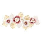 Large metal wall sculpture with blush pink flowers and gold ginkgo-style leaves, front view
