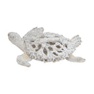 White coral-pattern sea turtle sculpture, front three-quarter view