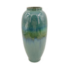 Tall teal reactive-glaze ceramic vase on a white background