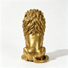 Gold seated lion statue, back view of the carved mane