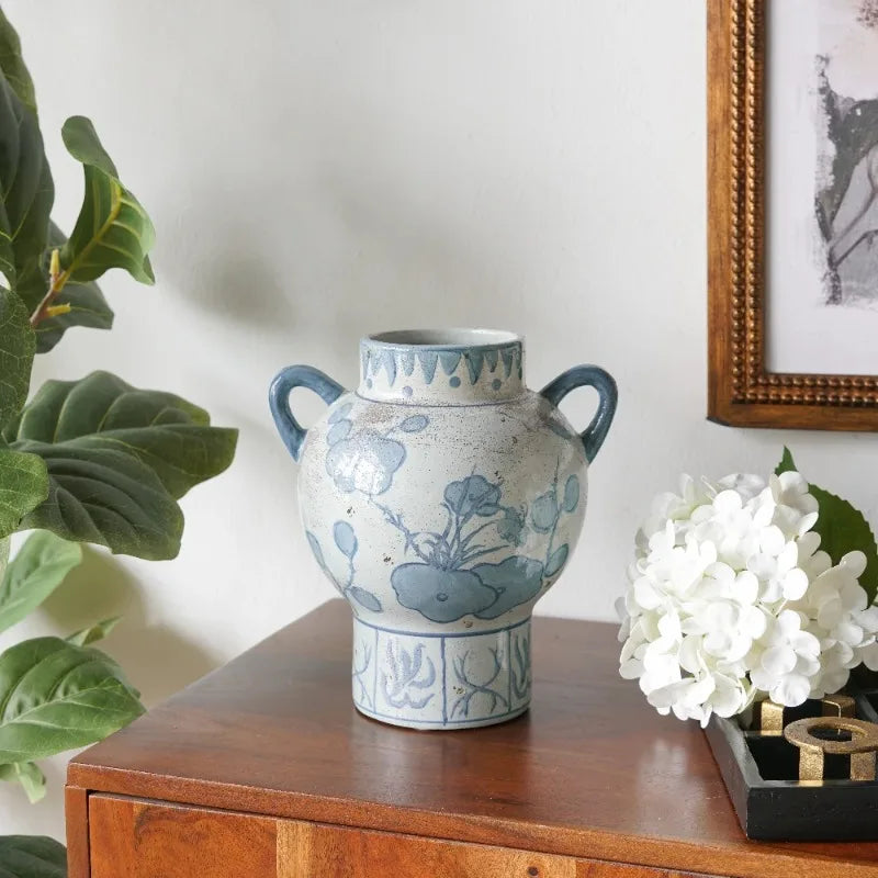 Blue and white floral amphora vase on a wood console