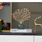 Gold Coral Tree on Marble Base, styled on a console beside a gold deer figurine