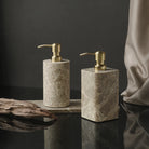 Round and square Emperador marble soap dispensers with gold-tone pumps