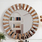 Round starburst wall mirror with beveled mirrored and bronze-tone glass segments