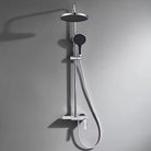 Chrome 3-way exposed rainfall shower system with round rain head, handheld shower and mixer on a grey wall
