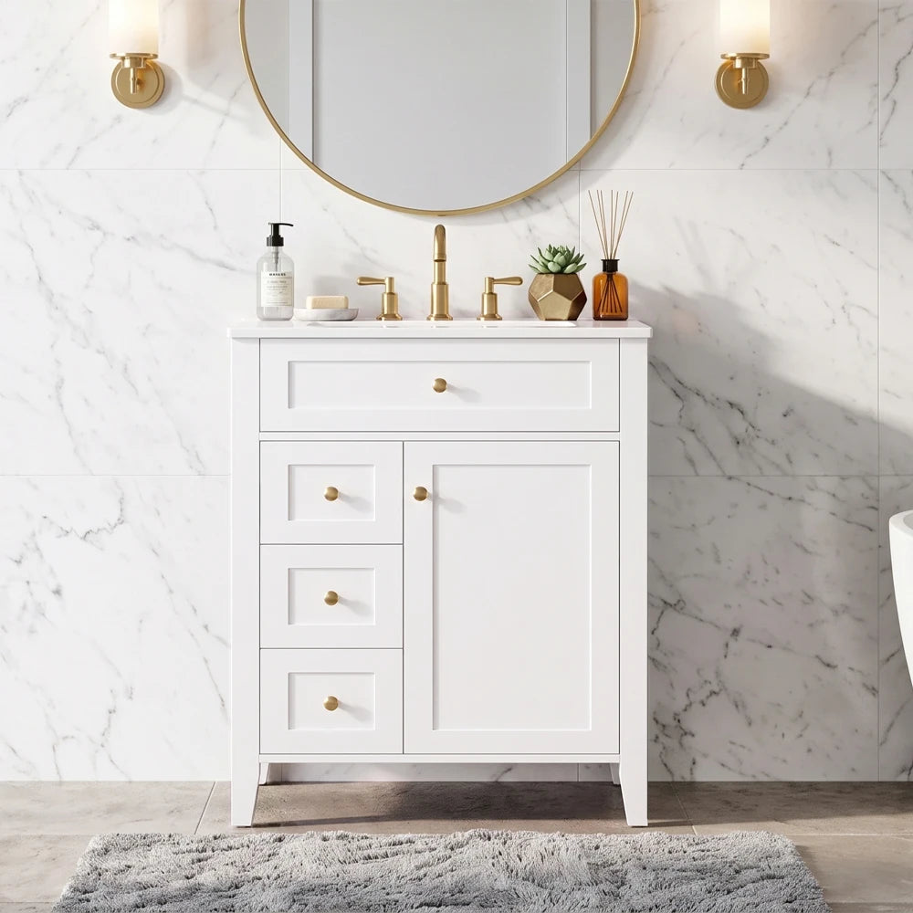 White vanity with gold knobs under a round gold mirror