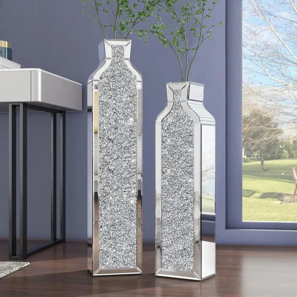 Pair of mirrored crushed-crystal floor vases, 24 and 30 in, by a window