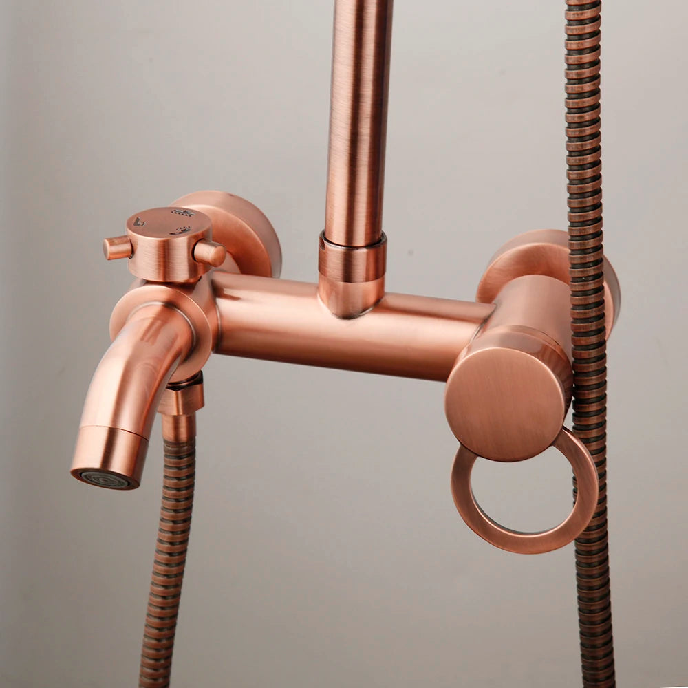 Close-up of the antique copper shower mixer valve, tub spout and handheld hose