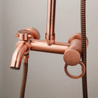 Close-up of the antique copper shower mixer valve, tub spout and handheld hose