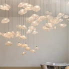 Many amber-toned cloud glass pendant lights suspended above a cafe table