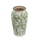 White ceramic vase with green floral pattern
