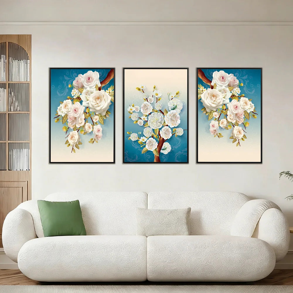 Three framed white blossom prints in a living room