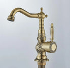 Tall carved antique brass basin faucet, front view