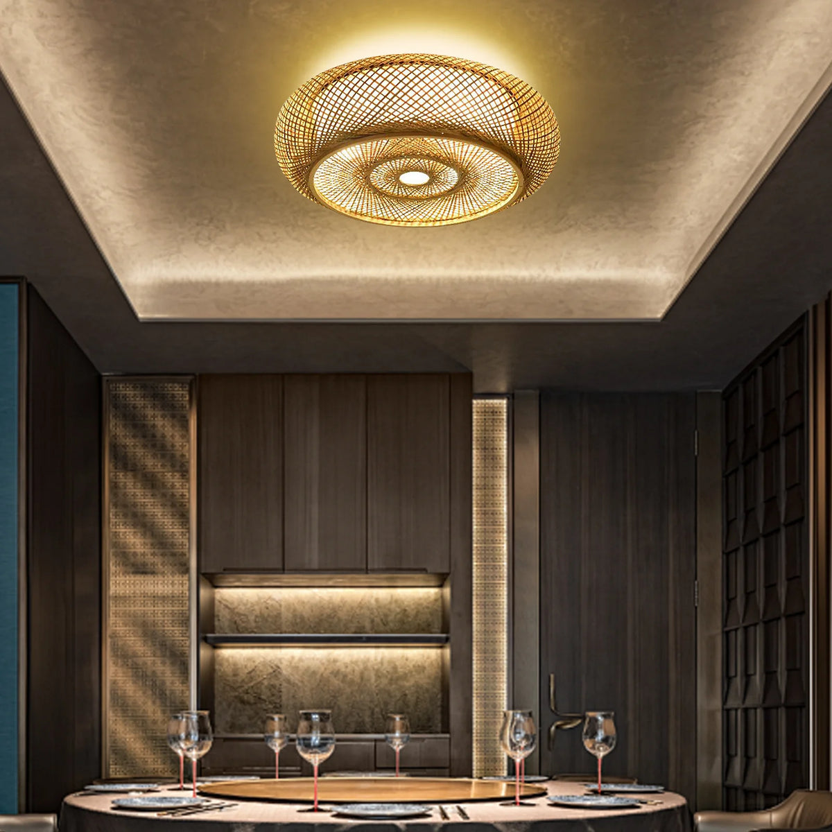 Woven bamboo ceiling light in a dark modern room