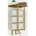 Brushed gold wall towel rack with a top shelf, rolled towels and three hooks