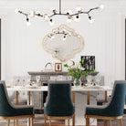 Quatrefoil wall mirror with a slim gold rim over a console table