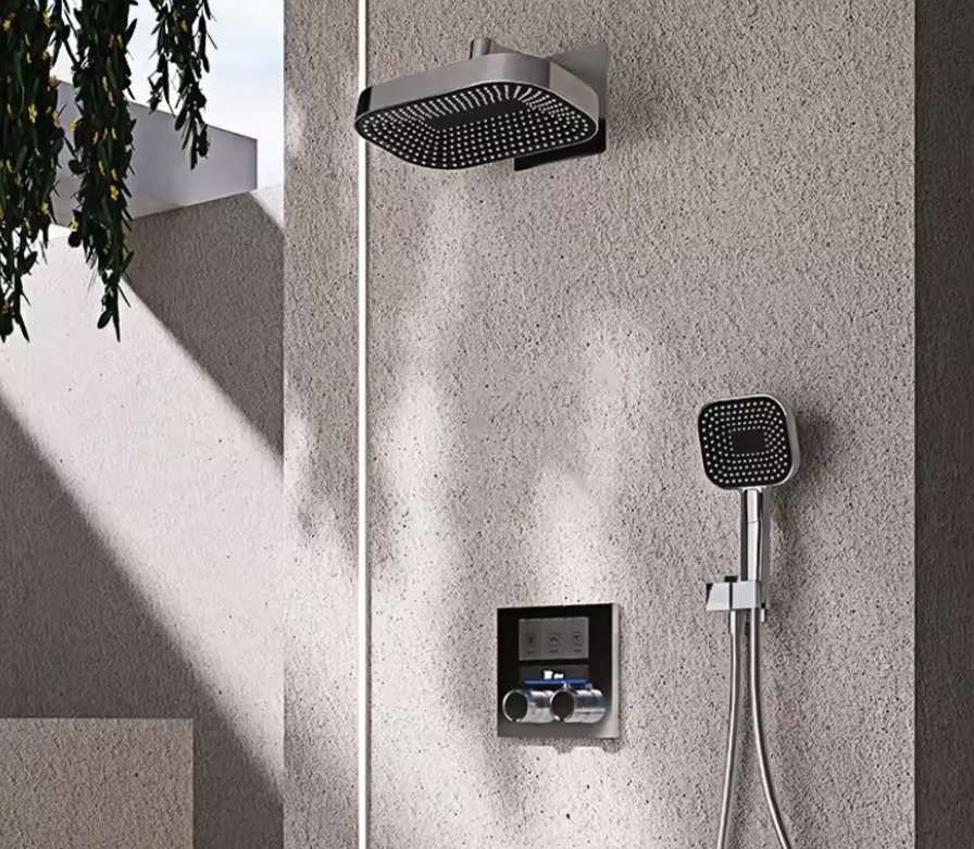 Grey concealed 3-function rainfall shower set with square rain head, handheld shower and digital mixer panel on a stone wall