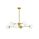 Eight-light gold chandelier with white globes on a white background