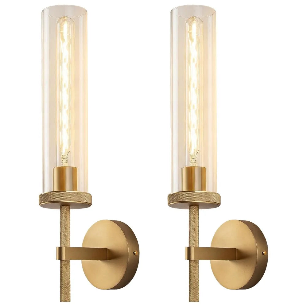 Pair of knurled gold-tone wall sconces with glass tube shades on a white background