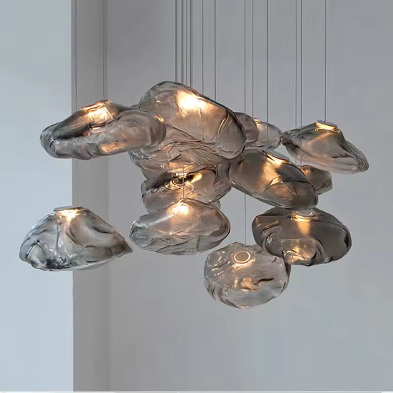 Cluster of smoky grey cloud glass pendant lights glowing