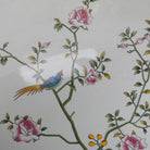 Detail of a bird and blossoms on the white porcelain