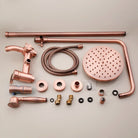 Antique copper rainfall shower set laid out: round rain head, riser, hand shower and fittings