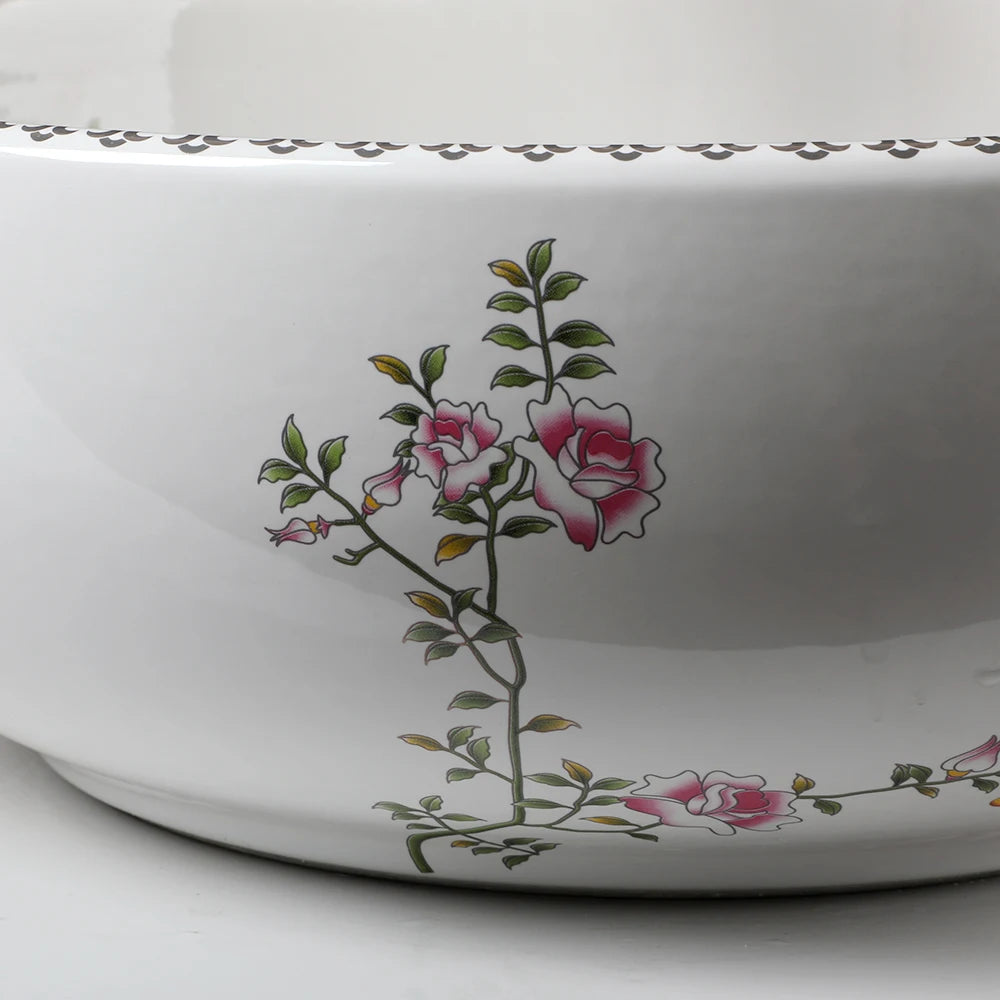 Close-up of the painted blossom pattern on the outside of the porcelain sink