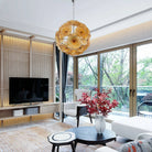 Amber glass flower chandelier in a living room with garden windows