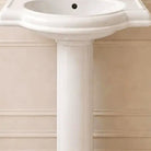 Close-up of the glossy white ceramic basin, its softly curved bowl and gracefully flared rim