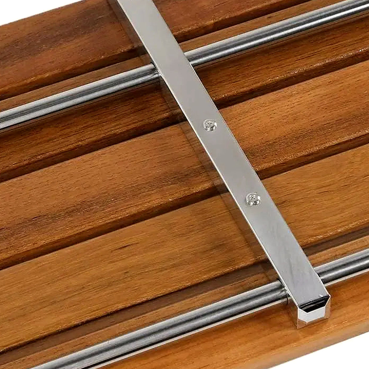 Close-up of the teak slats and chrome bracing on the shower bench