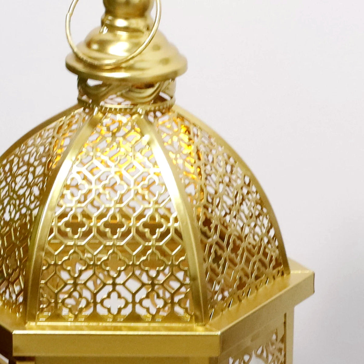 Close-up of the pierced gold filigree dome on the larger Moroccan lantern (candle not included)