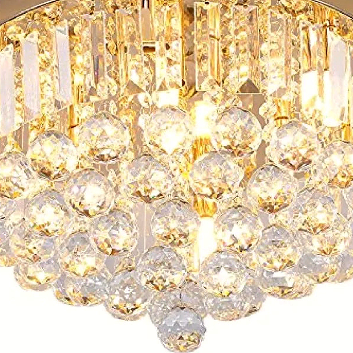 Close-up of rectangular crystal prisms and faceted crystal spheres on the gold drum flush mount