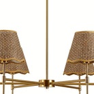 Close-up of the woven conical shades and gold arms on the six-light chandelier