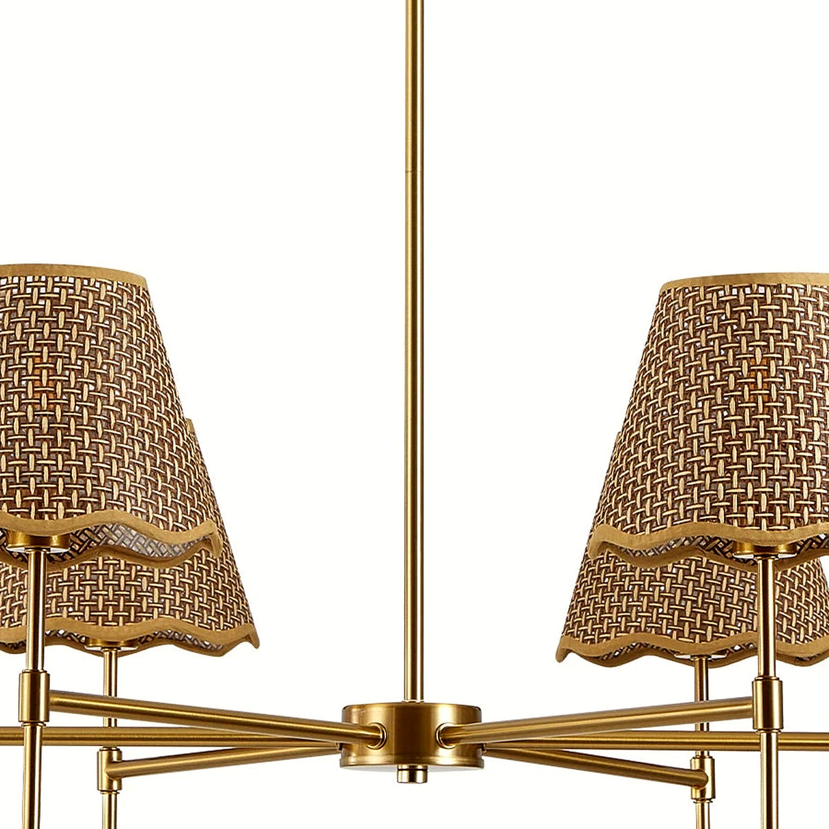 Close-up of the woven conical shades and gold arms on the six-light chandelier